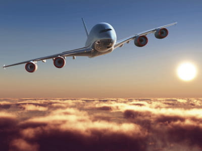 Fototapete Flugzeug über den Wolken