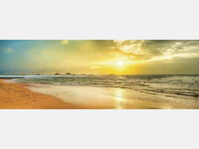 Fototapete Morgendämmerung über dem Strand