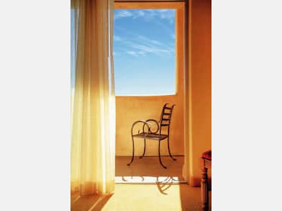 Fototapete Stuhl am Fenster