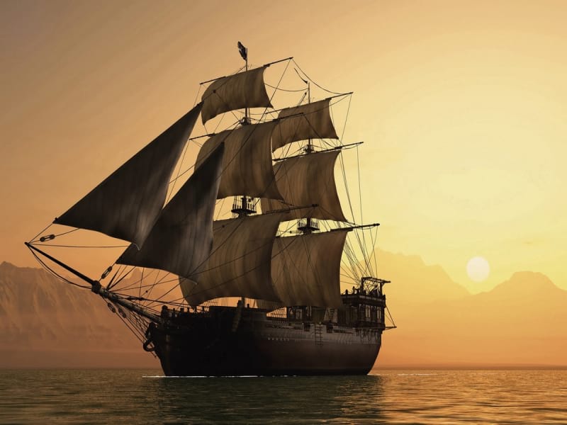 Fototapeta Schiff vor Sonnenuntergang im Hintergrund