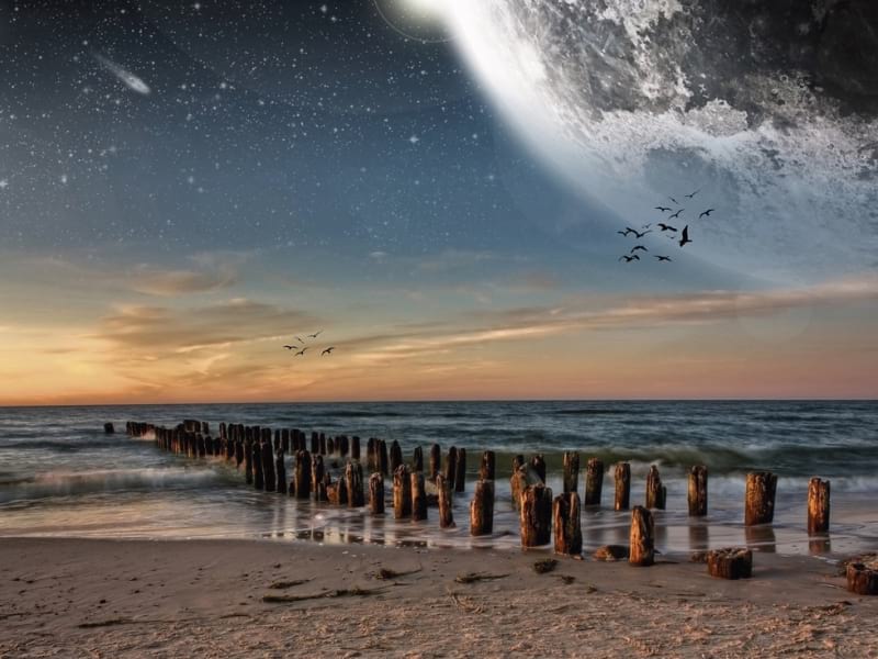 Fototapeta Mond über dem Strand