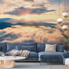 Miniatura fototapety Morgendämmerung über den Wolken we wnętrzu salonu